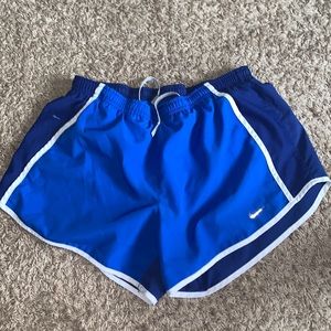 Blue Nike running shorts